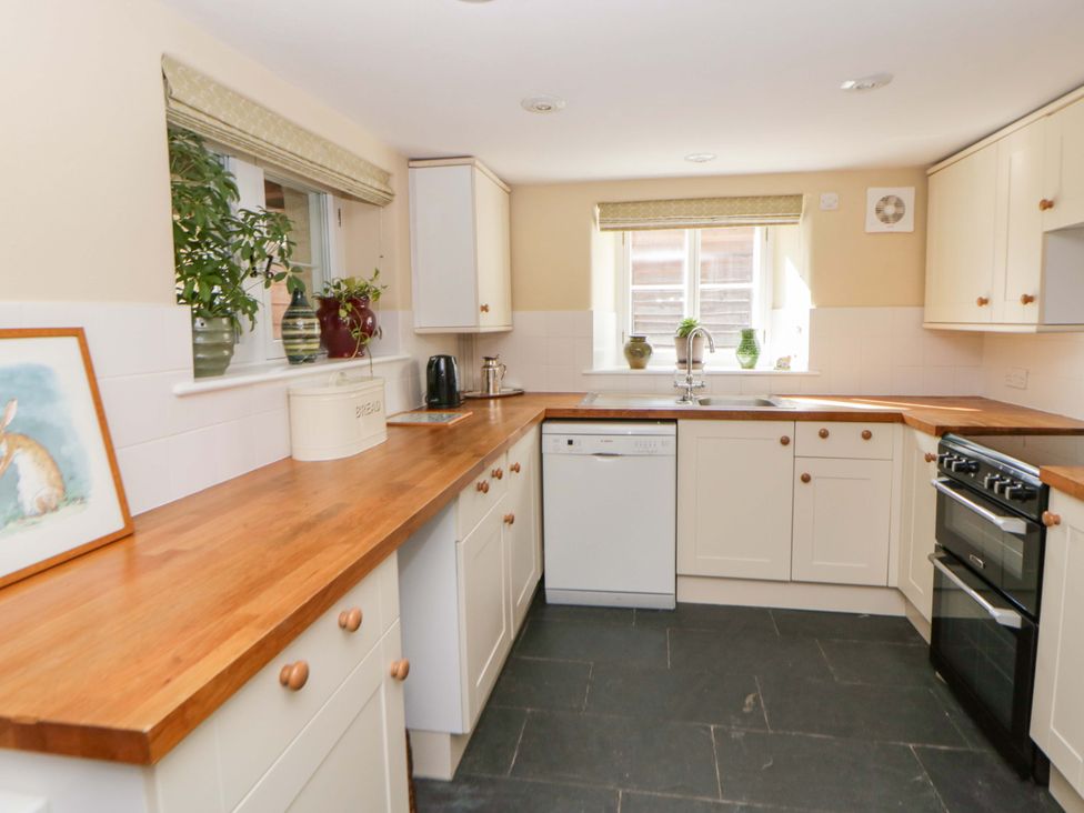 A kitchen with a sink and appliances at North Cottage in Myddfai near Llandovery