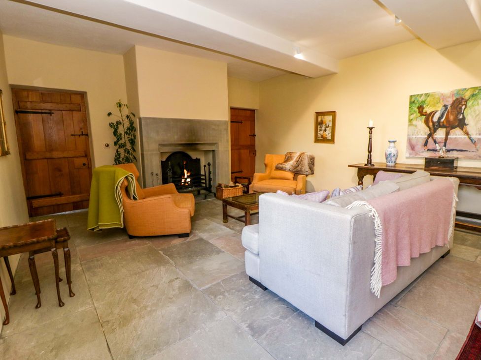 A living room with a fireplace and seating area at North Cottage Myddfai near Llandovery