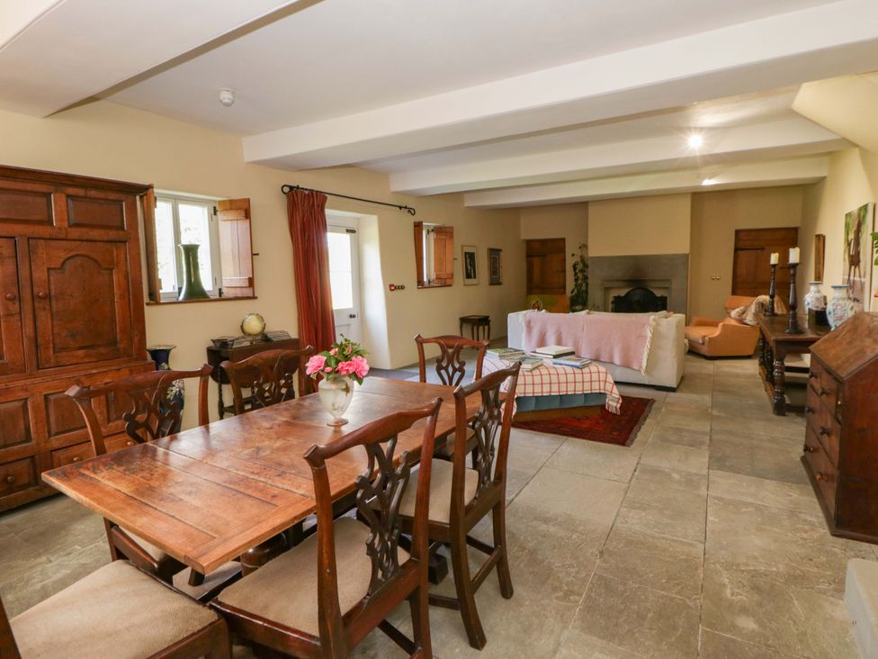 A dining room with a table and chairs at North Cottage Myddfai near Llandovery