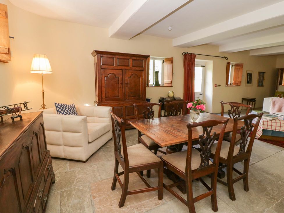 A dining room with a table and chairs at North Cottage Myddfai near Llandovery