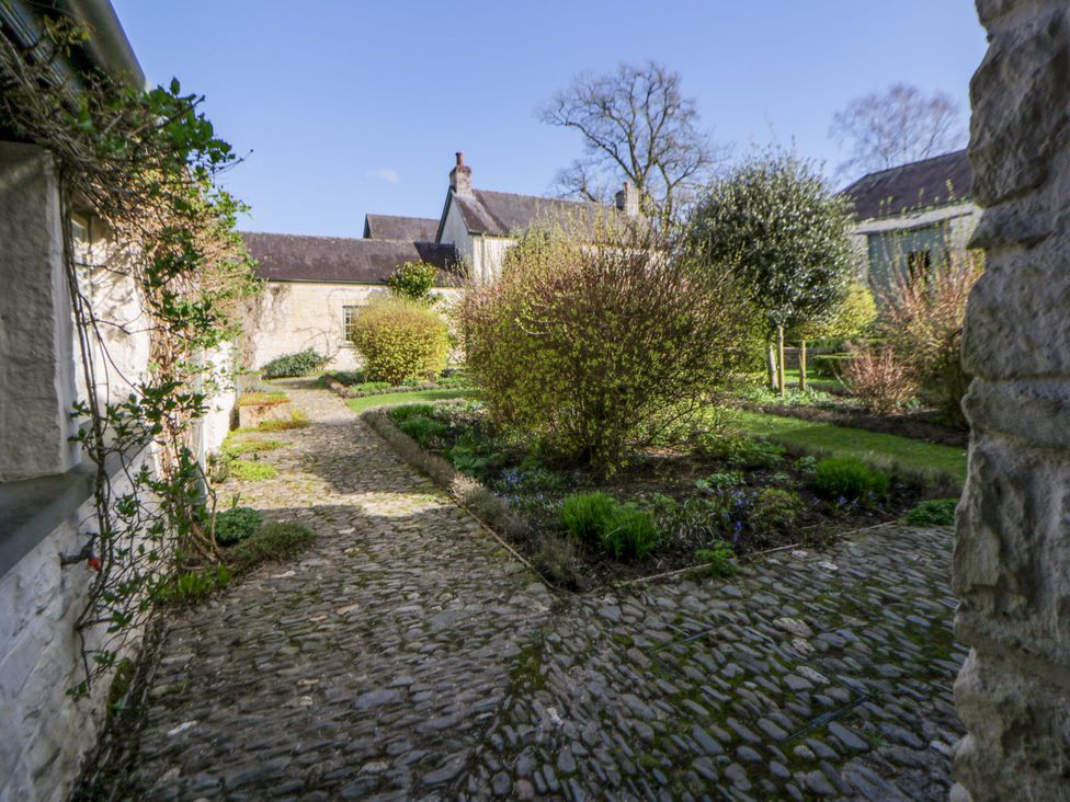 A garden with a pathway and plants at North Cottage in Myddfai near Llandovery