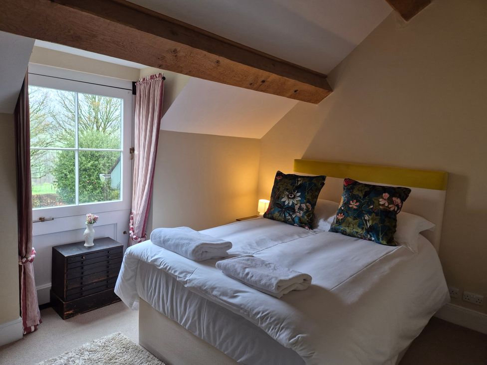 A bedroom with a bed and window at North Cottage Myddfai near Llandovery