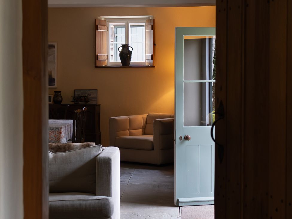A living room with a sofa and a table at North Cottage Myddfai near Llandovery
