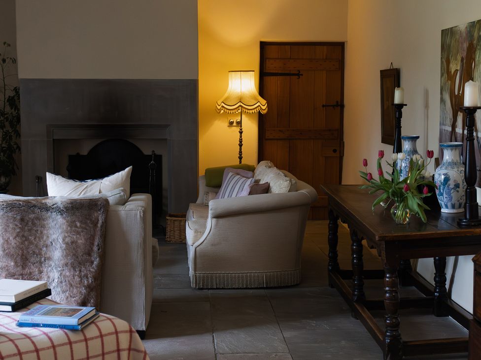 A living room with a sofa and lamp at North Cottage Myddfai near Llandovery