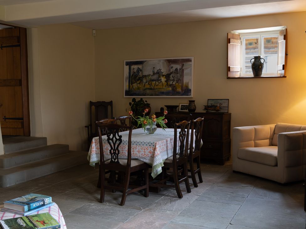 A dining room with a table and chairs at North Cottage Myddfai near Llandovery