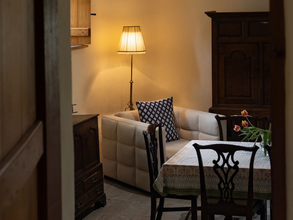 A living room with a sofa and lamp at North Cottage Myddfai near Llandovery