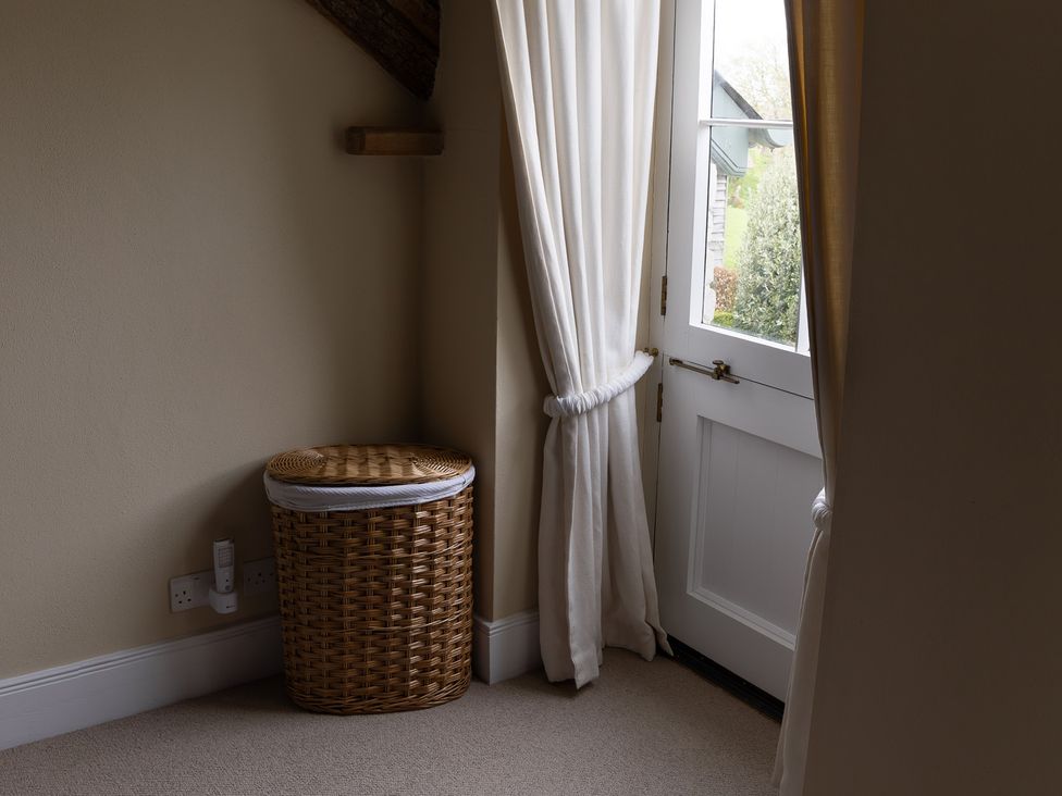 An entrance with a basket and curtains at North Cottage Myddfai near Llandovery