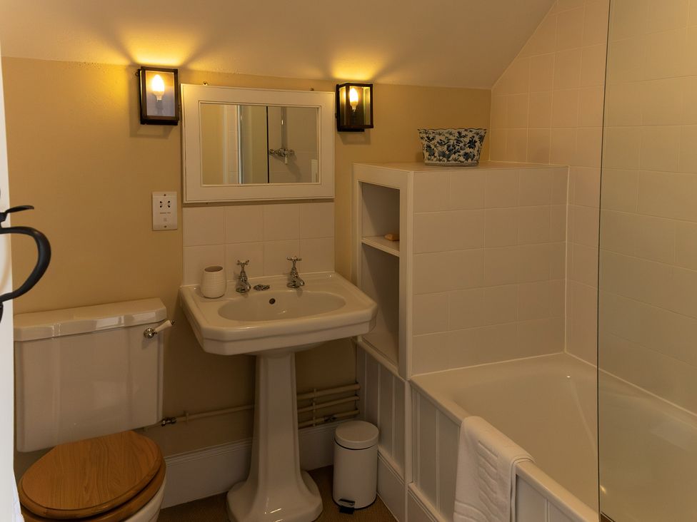 A bathroom with a sink and bathtub at North Cottage in Myddfai near Llandovery