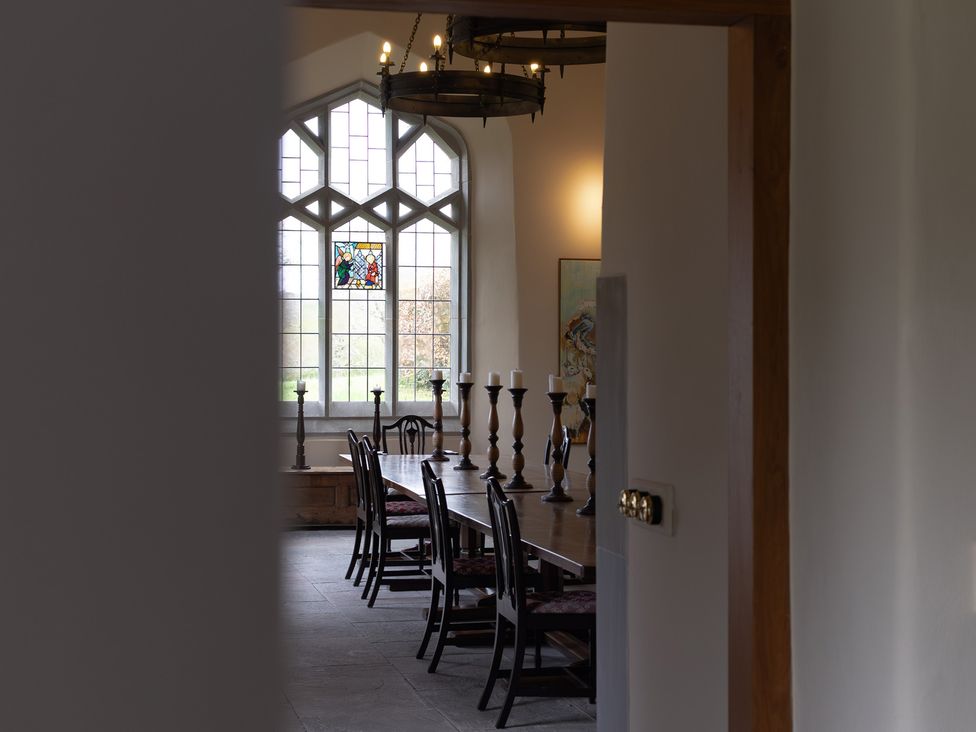 A dining room with a table and chairs at North Cottage in Myddfai near Llandovery