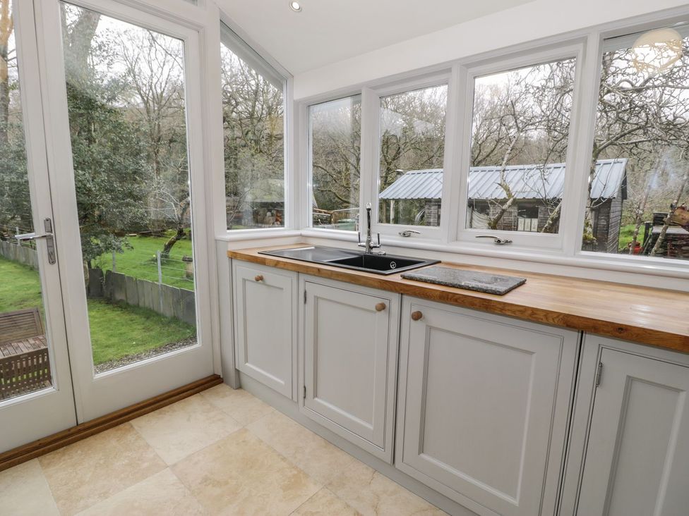 A kitchen with a sink and countertop at Peniel Cottage Caernarfon