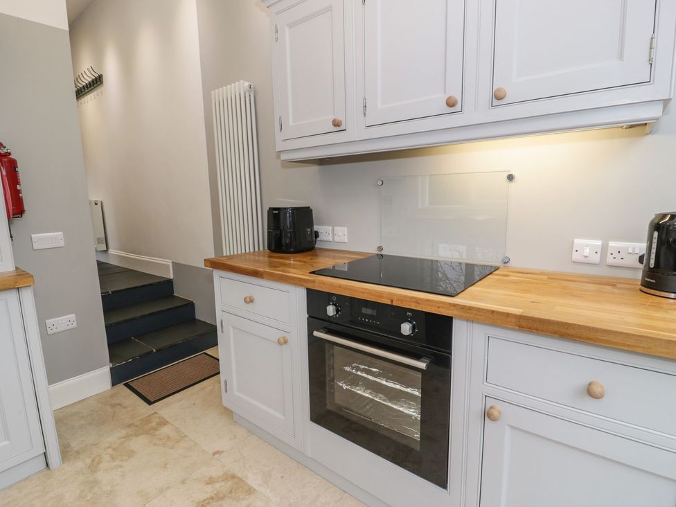 A kitchen with an oven and kettle at Peniel Cottage in Caernarfon