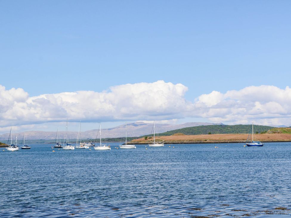 Sailboats on water with hills and clouds at 1 Balnakeil in Dunbeg