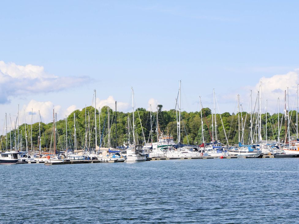 A marina with several boats docked at the waterfront at 1 Balnakeil, Dunbeg