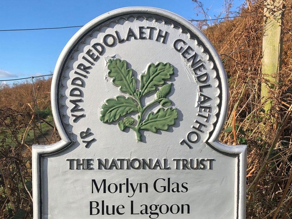 Sign indicating Morlyn Glas Blue Lagoon at The National Trust