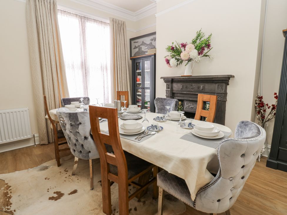 A dining room with a table set for a meal at St Ronans in Bishop Auckland