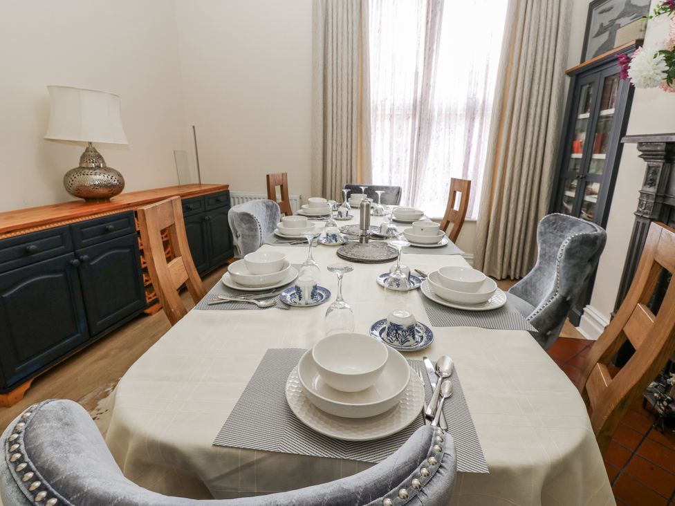 A dining room with a table set for a meal at St Ronans in Bishop Auckland