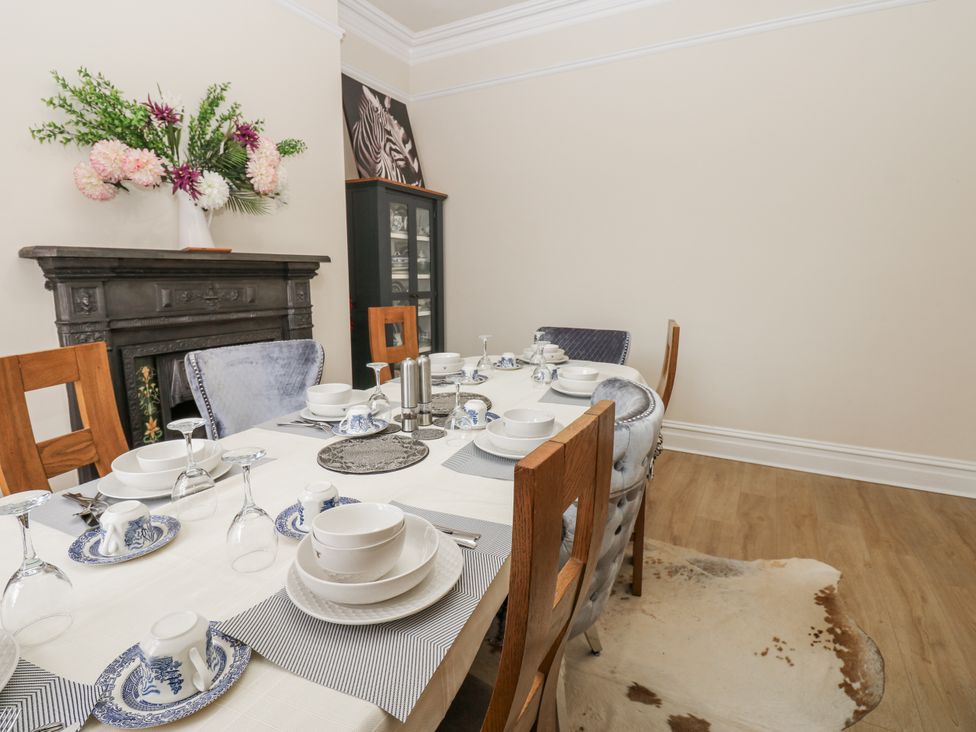 A dining room with a table set for dinner at St Ronans in Bishop Auckland
