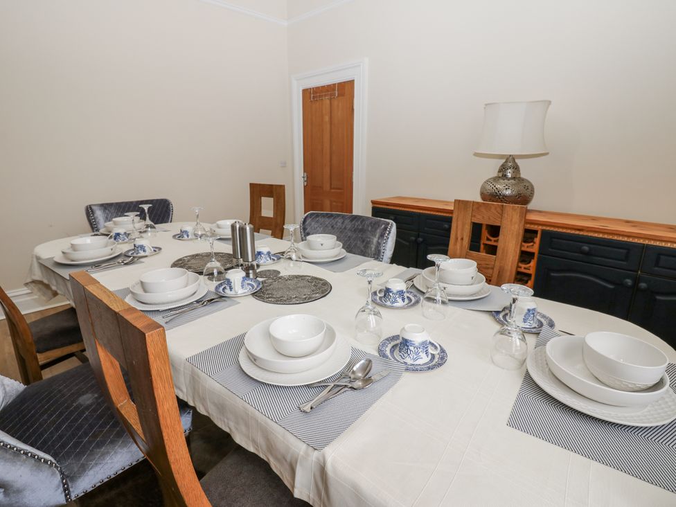 A dining room with a table set for a meal at St Ronans in Bishop Auckland