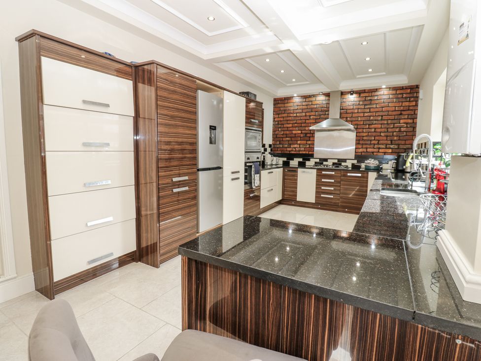 A kitchen with cabinets and appliances at St Ronans in Bishop Auckland