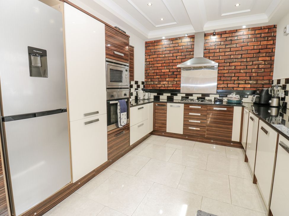 A kitchen with appliances and cabinets at St Ronans in Bishop Auckland