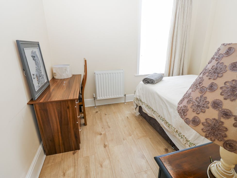 A bedroom with a desk and chair at St Ronans in Bishop Auckland