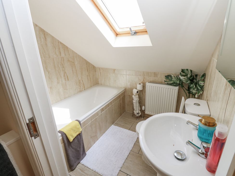 A bathroom with a bathtub and sink at St Ronans in Bishop Auckland