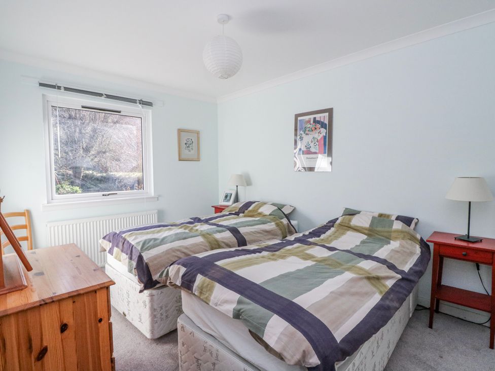 A bedroom with two beds and a window at Grianach in Balnaguard near Strathtay