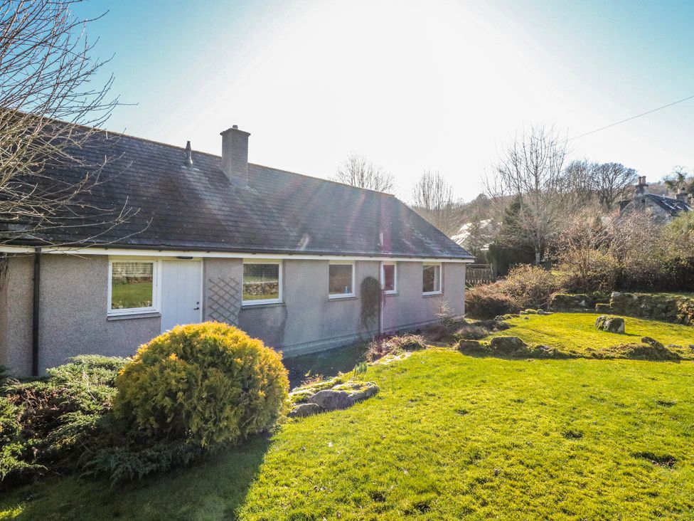 A house with garden and trees at Grianach Balnaguard near Strathtay