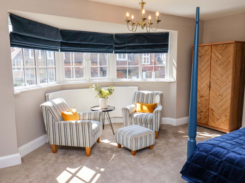 A living room with two armchairs and a side table at 16 High Street