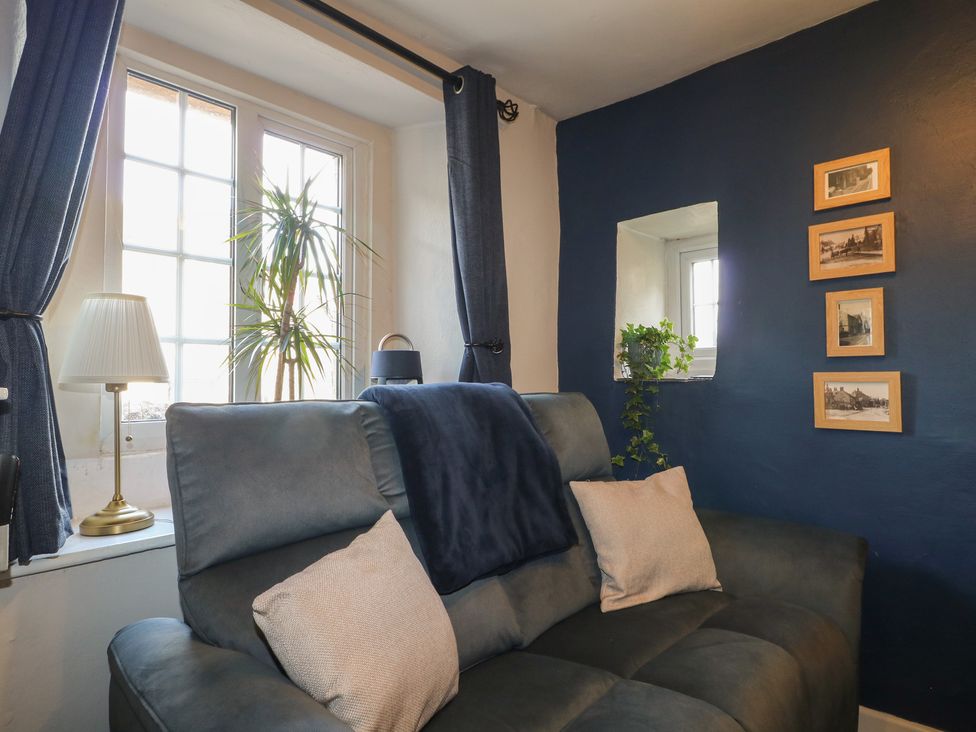 A living room with a sofa and window at Blindwell House 