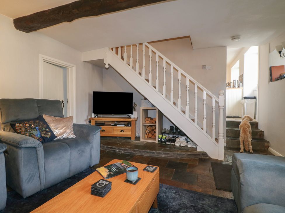 A living room with a sofa and television at Blindwell House