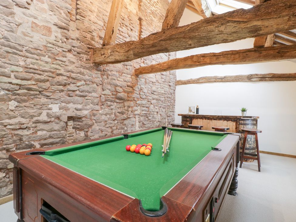 A game room with a pool table and bar area at Two Parks Barn Upton Bishop near Ross-On-Wye