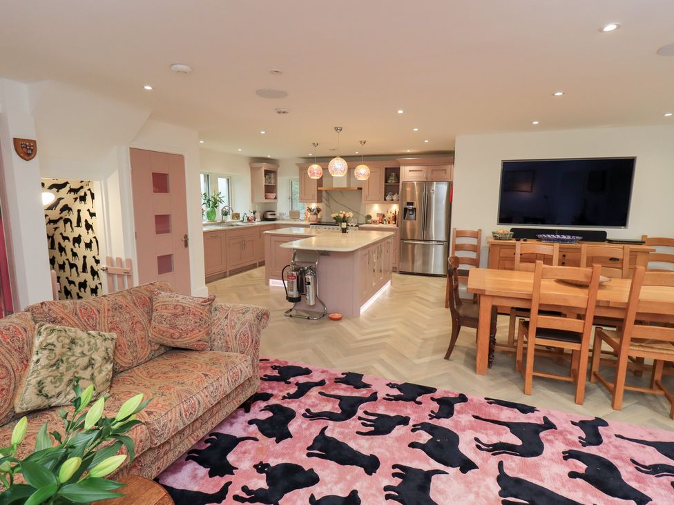 A kitchen with a sofa and dining area at Hallbeck in Buckden