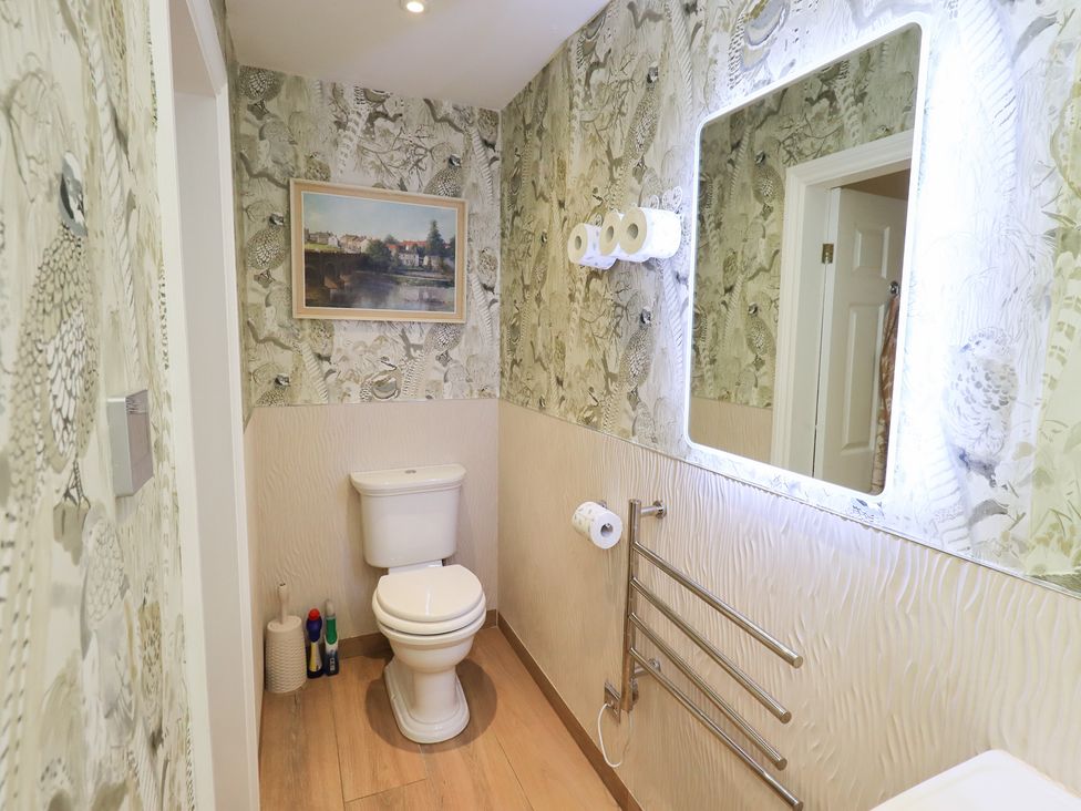A bathroom with a toilet and sink at Hallbeck in Buckden