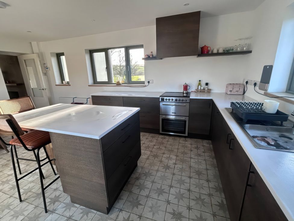 A kitchen with cabinets and appliances at Knocknanuss