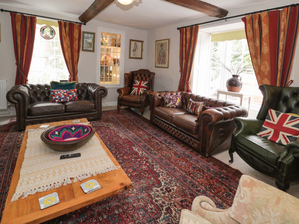 A living room with sofas and a coffee table at Bryn Dwr in Llangollen