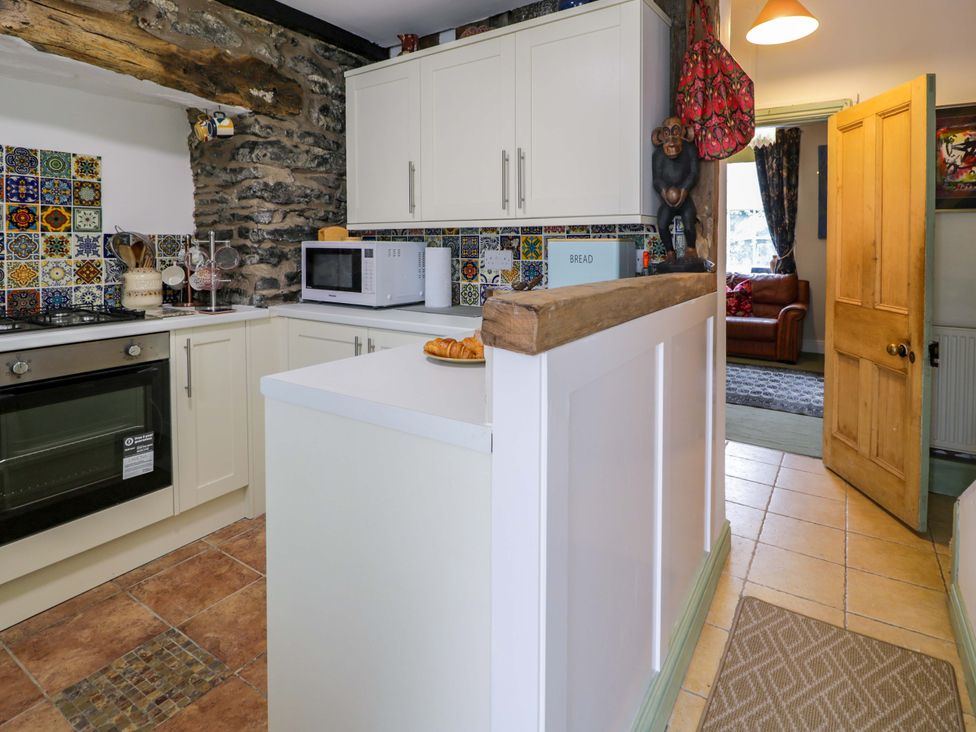 A kitchen with a countertop and appliances at Bryn Dwr in Llangollen