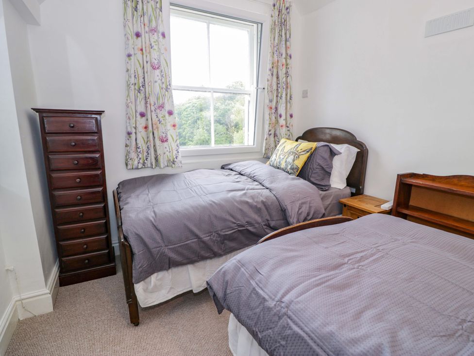 A bedroom with two beds and a drawer at Bryn Dwr in Llangollen