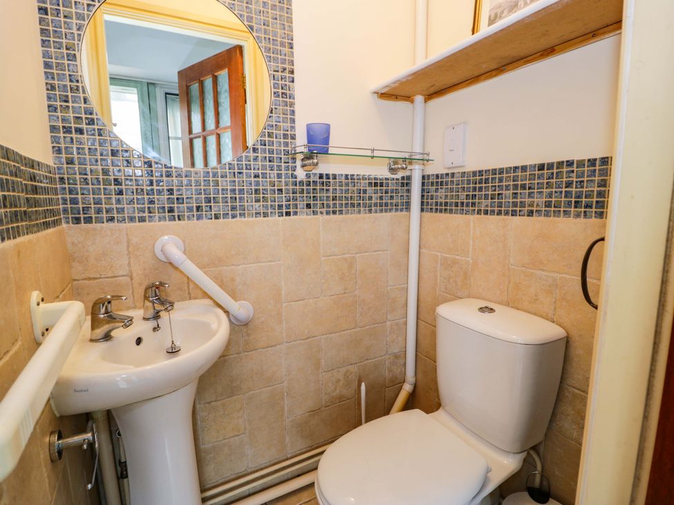 A bathroom with a sink and toilet at Bryn Dwr in Llangollen