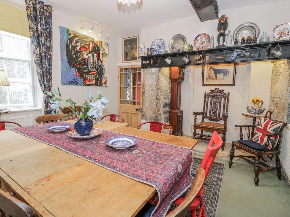 A dining room with a table and chairs at Bryn Dwr in Llangollen