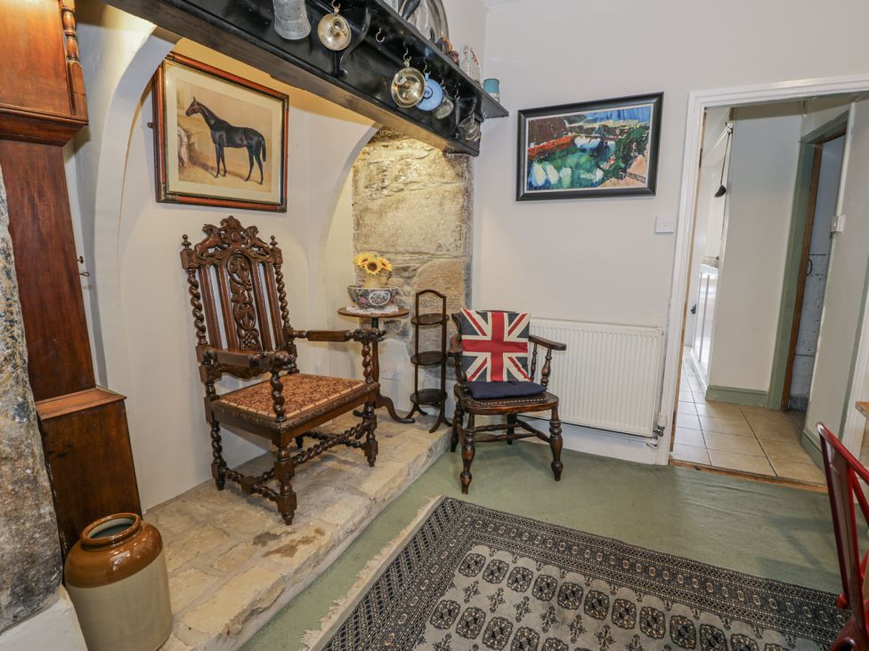 A snug with chairs and a table at Bryn Dwr in Llangollen