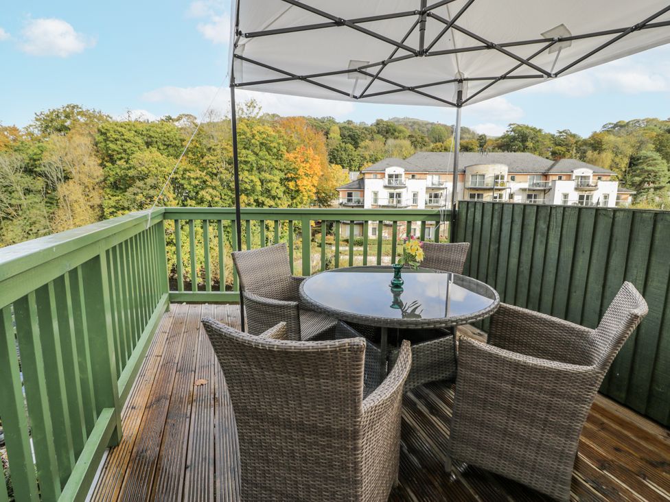 A balcony with a table and chairs at Bryn Dwr in Llangollen