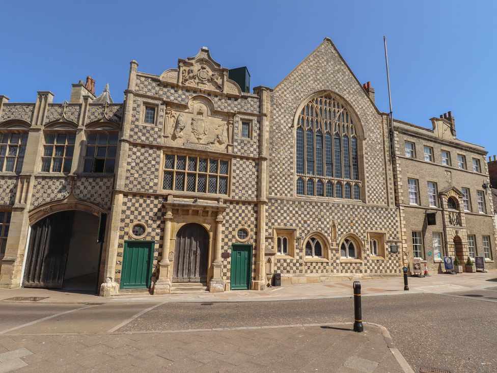 A historic building with patterned walls and large windows at Corner House in King's Lynn