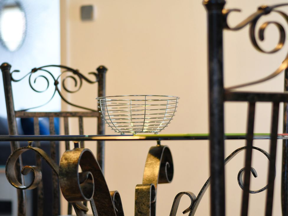 A table with a basket and chairs at Seahorse in Filey