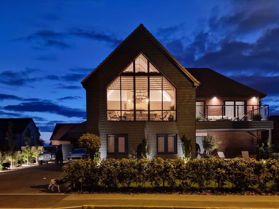 A house with large windows and garden at Calm Waters Luxury Beach House in Bridlington