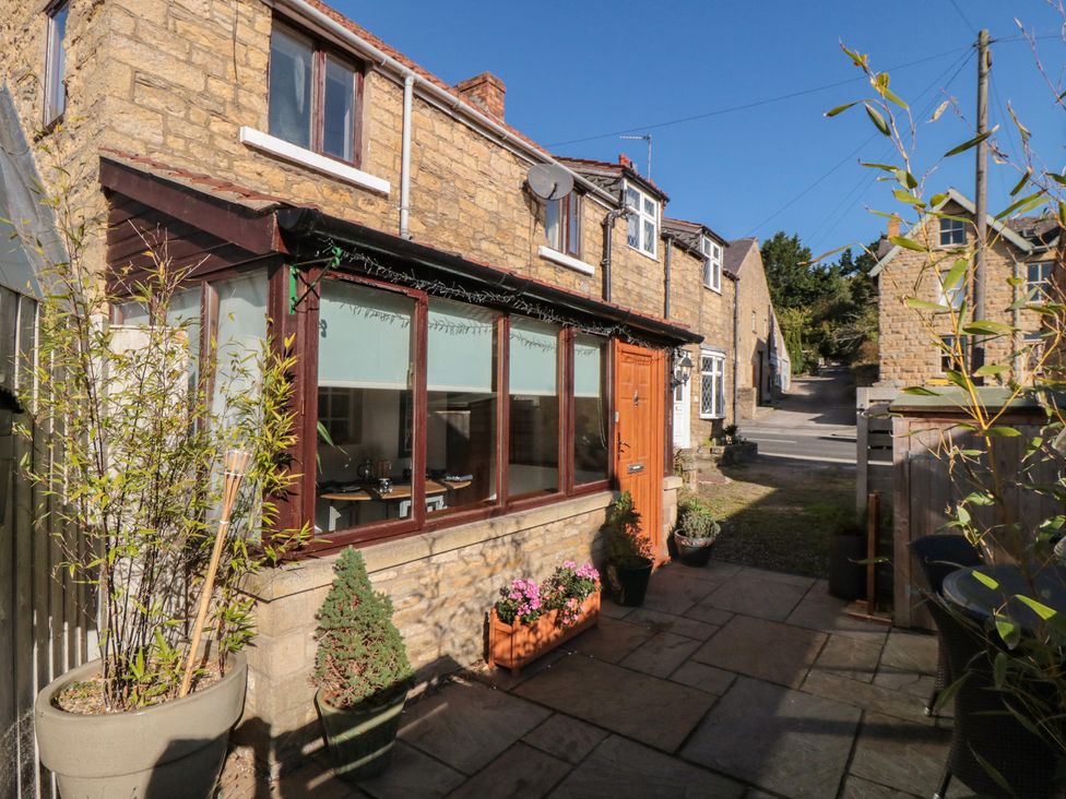 An outdoor area with a garden and a door at 35 High Street in Scarborough