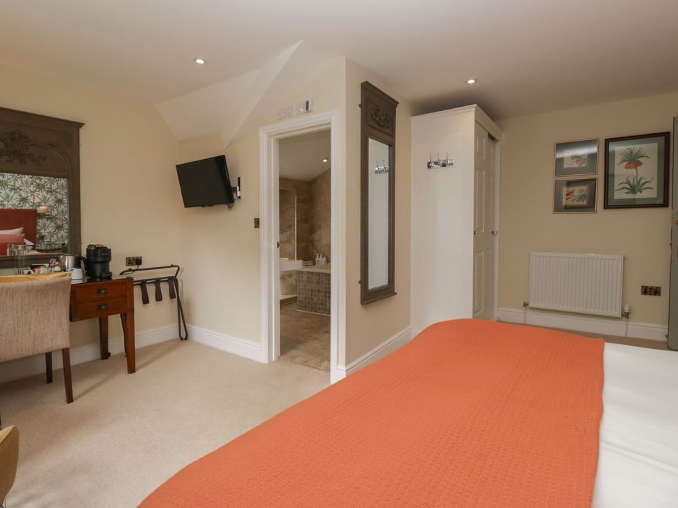 A bedroom with a bed and television at Shelley in Ambleside