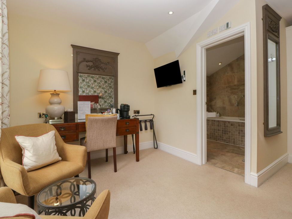 A bedroom with a desk and chair at Shelley in Ambleside