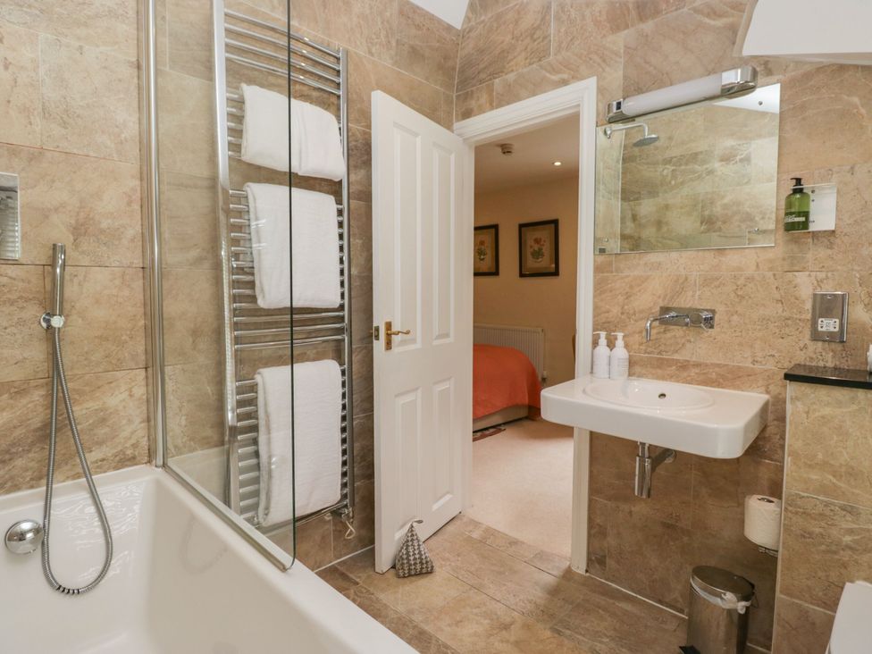 A bathroom with a bathtub and sink at Shelley in Ambleside