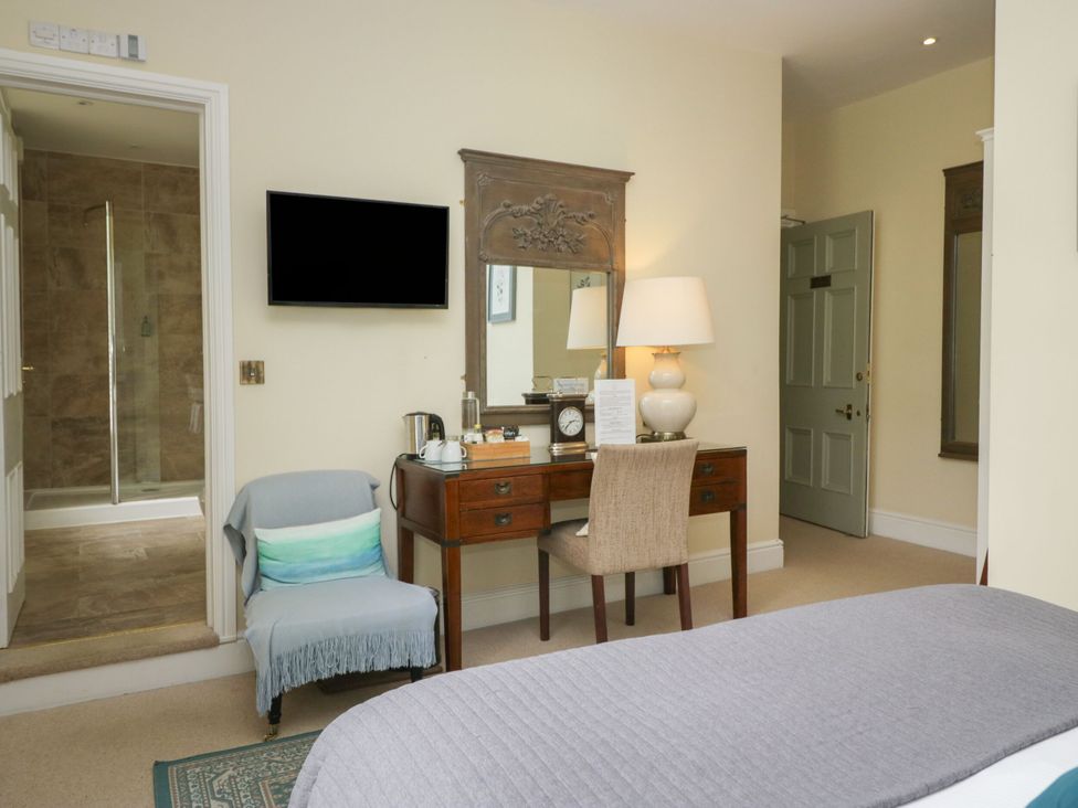 A bedroom with a desk and chair at Coleridge in Ambleside